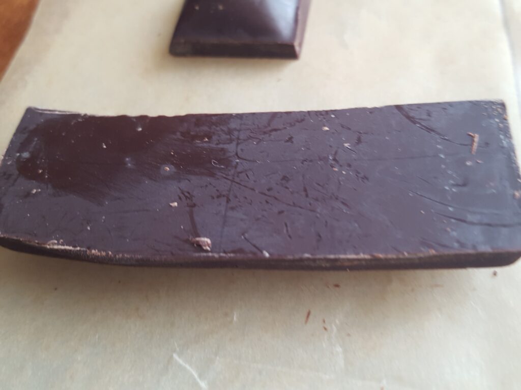 This chocolate is shiny on the front and had a layer of white over the back. This didn't affect the flavor at all.